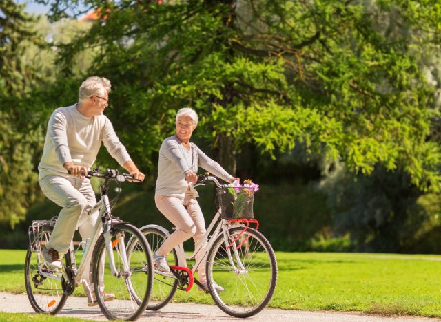 mature couple biking demonstrating exercise after meals