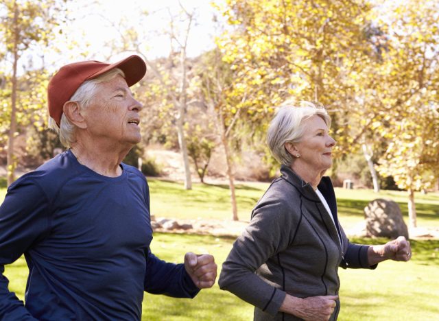 mature couple power walking