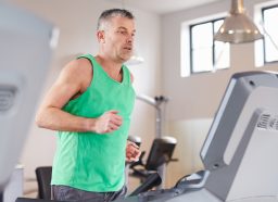 mature man demonstrating cardio treadmill workout to burn belly fat and slow aging