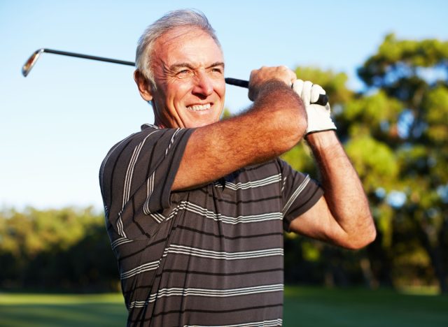 mature man golfing, performing one of the leisure activities that can extend your life