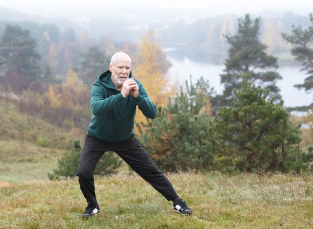 mature man doing side lunges, demonstrating exercise habits to slow muscle aging