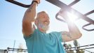 mature man performing workout to build stronger muscles in your 50s