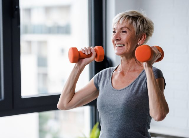 mature woman dumbbell workout