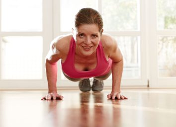 mature woman performing pushups, bodyweight exercises for bingo wings