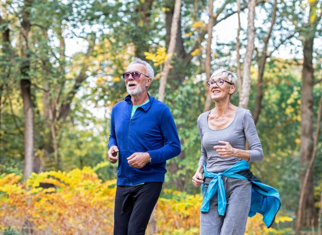 older couple running outdoors