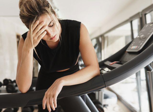 woman overtraining tired at the gym, demonstrating mistakes that are aging you faster