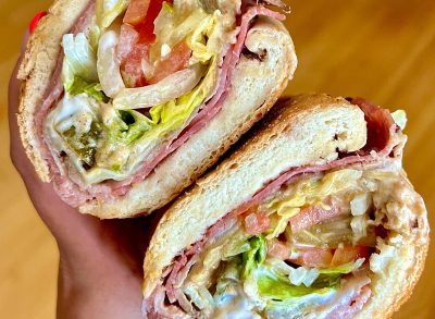 person holding potbelly sandwich