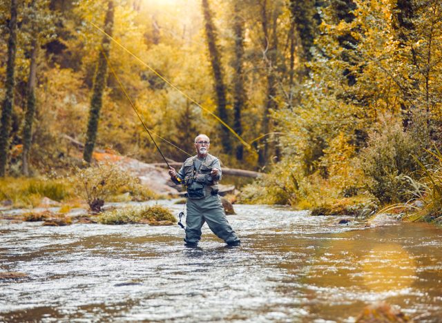 senior man fly fishing, fun fall activities that burn calories