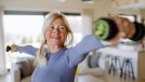 senior woman performing dumbbell exercises to slow down aging after 60