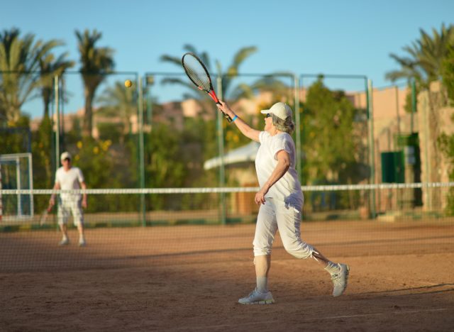 senior woman playing tennis