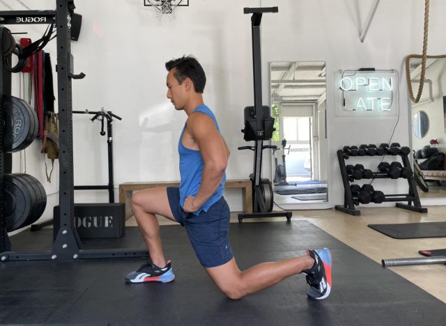 demonstrating split squat to get rid of a middle-aged spread