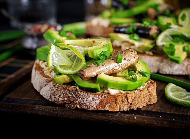 toast with cream cheese, avocado, and sardines