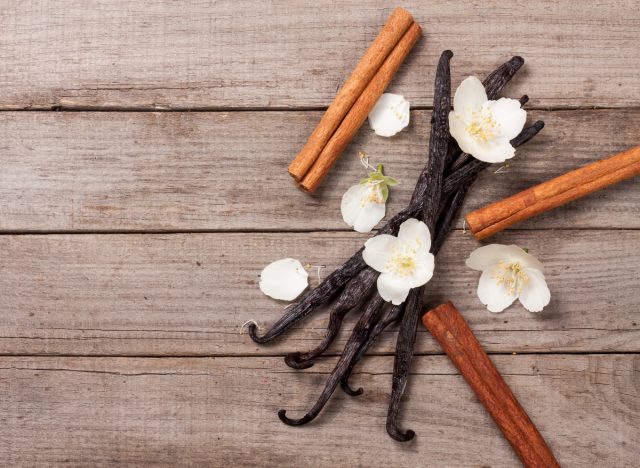 vanilla bean pods, cinnamon sticks, and flowers