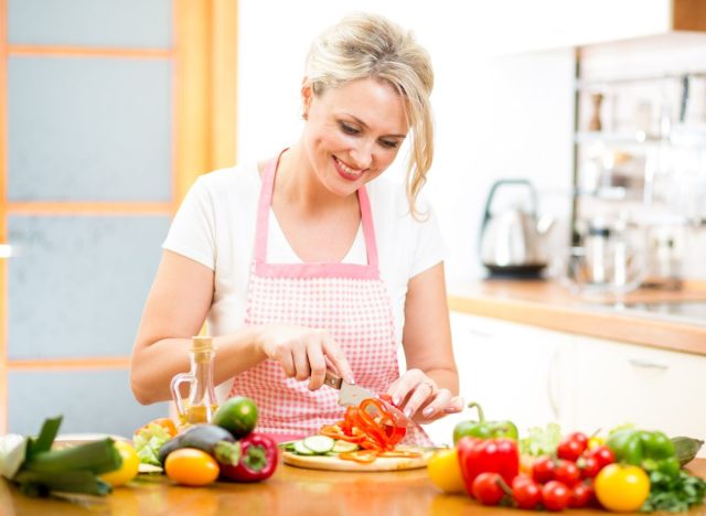 woman cutting veggies