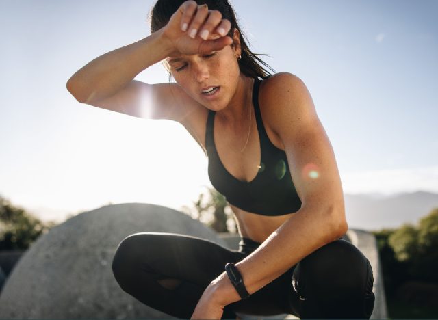 woman fatigued while working out outdoors
