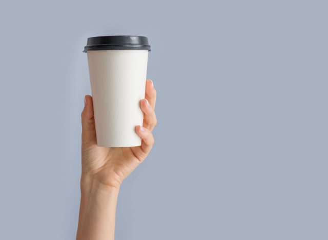 woman holding coffee cup