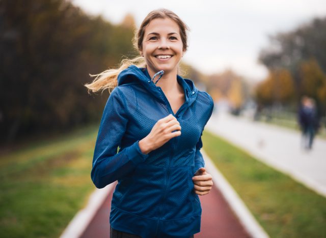 woman running on path outdoors