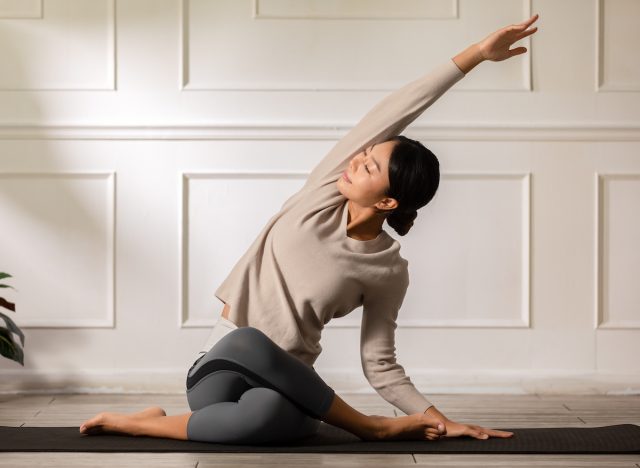 woman doing yoga exercises at home