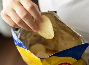 eating from a bag of chips
