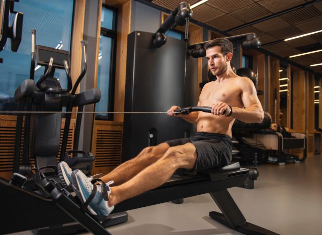 fit man indoor rowing, part of workout for V-taper back