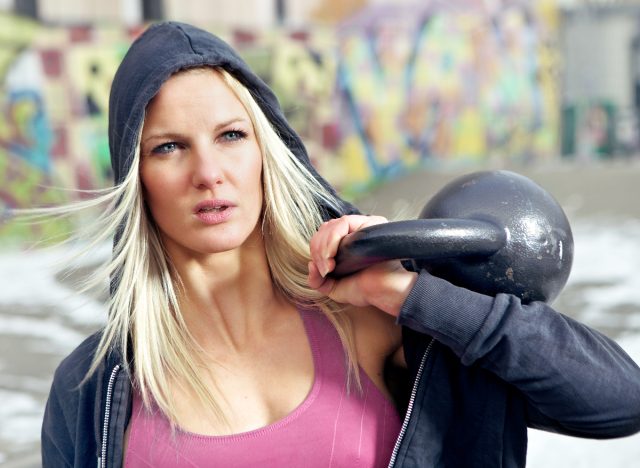 fit blonde woman kettlebell workout for your immune system