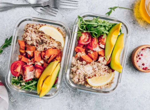 meal prepping bowls of quinoa, chicken, and avocado