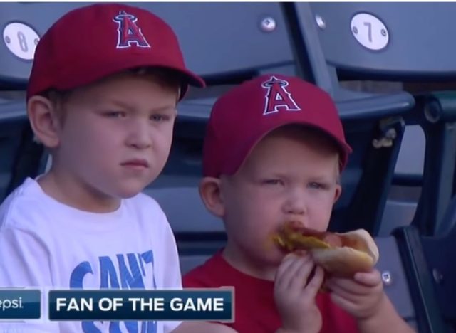 kid eating hot dog