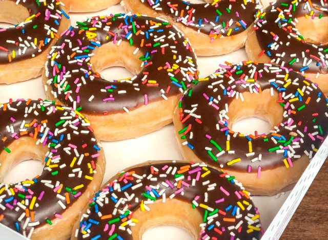 krispy kreme chocolate iced glazed doughnuts with sprinkles