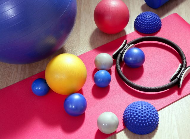 pilates and exercise balls on mat