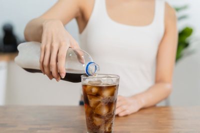 woman pouring soda