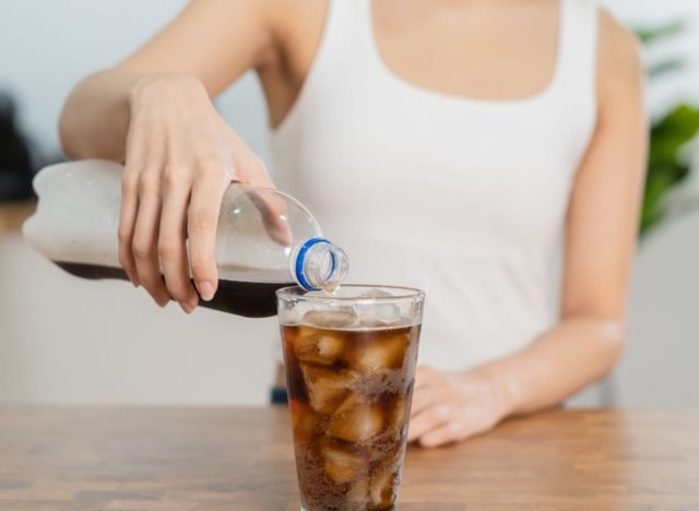 woman pouring soda