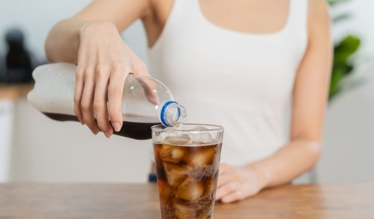 woman pouring soda