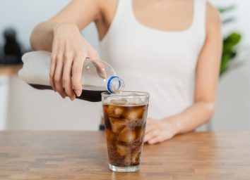 woman pouring soda