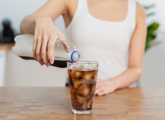 woman pouring soda