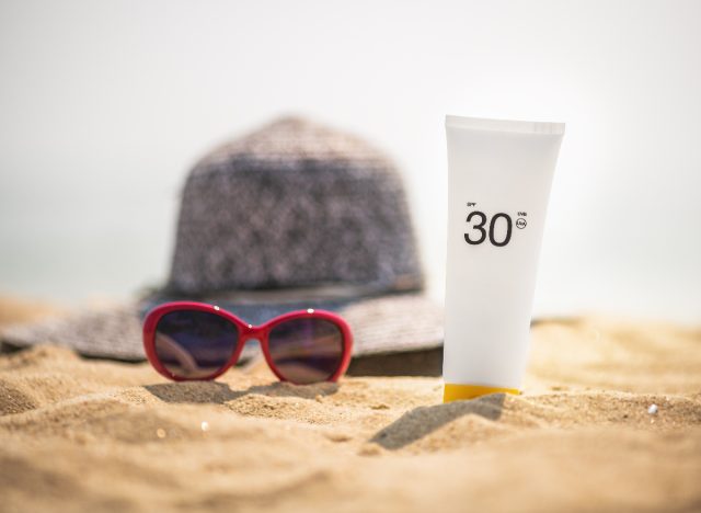 Sunscreen on the beach concept