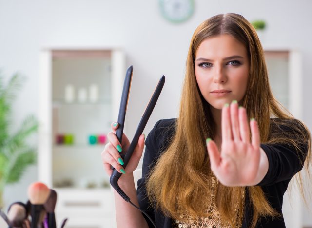 woman saying no to hair straightening treatments that cause cancer
