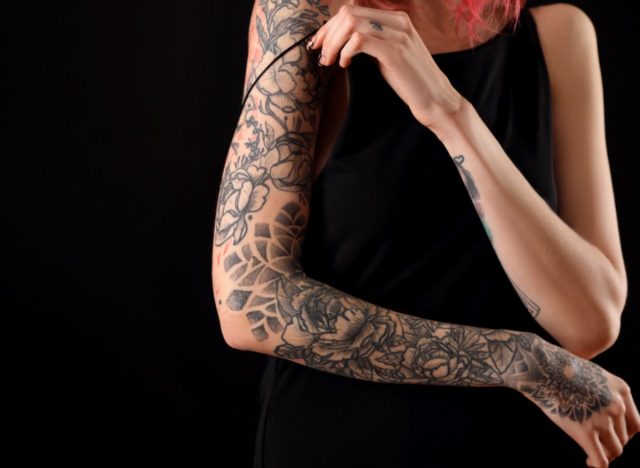 woman with arm of tattoos
