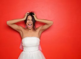 bride experiencing stress, anxiety concept of wedding day disasters
