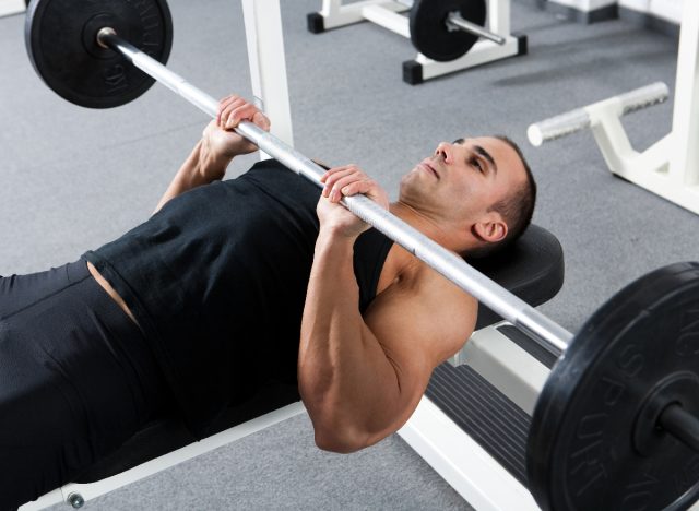 man performing close-grip bench press