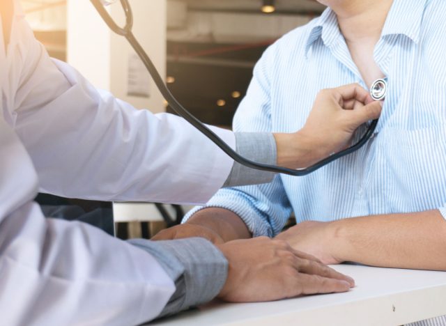 doctor checking someone's heart with a stethoscope