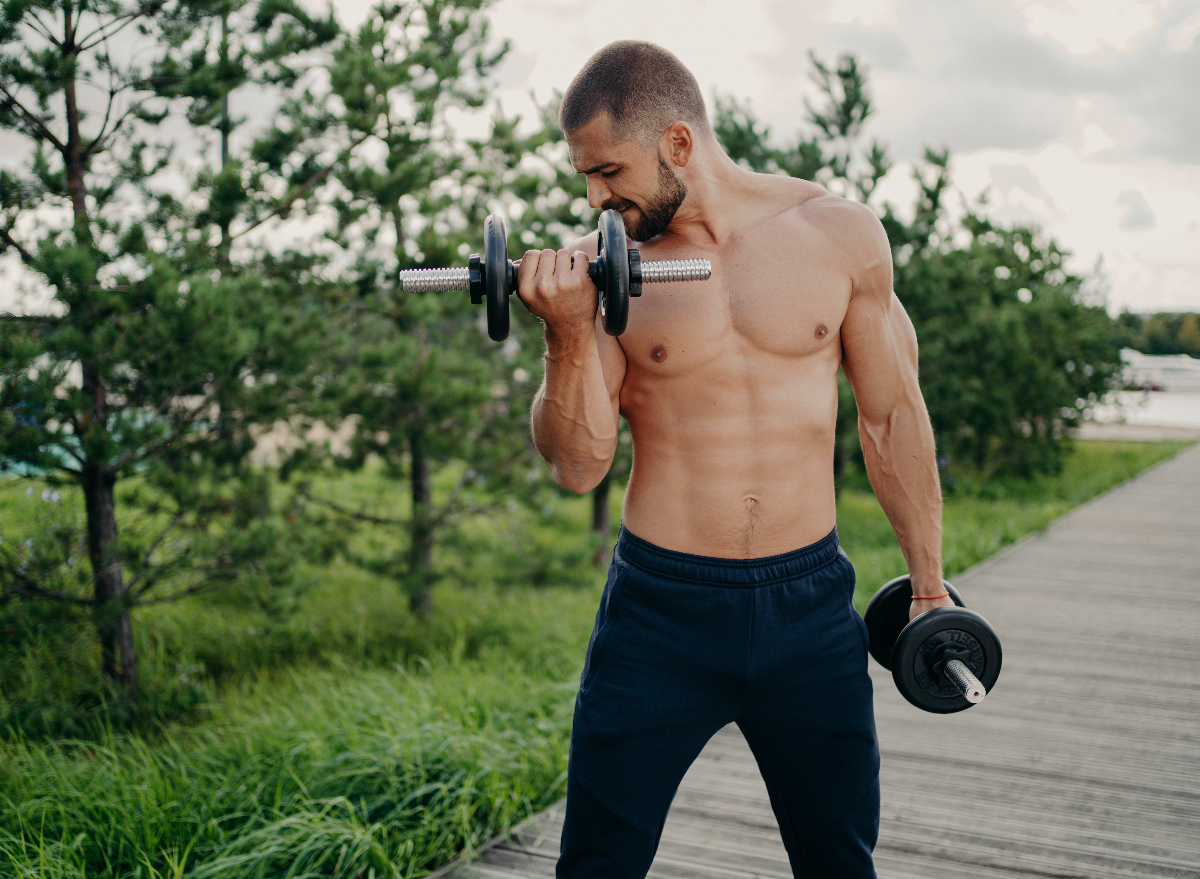 fit man lifting dumbbells outdoors, demonstrating weight lifting myths
