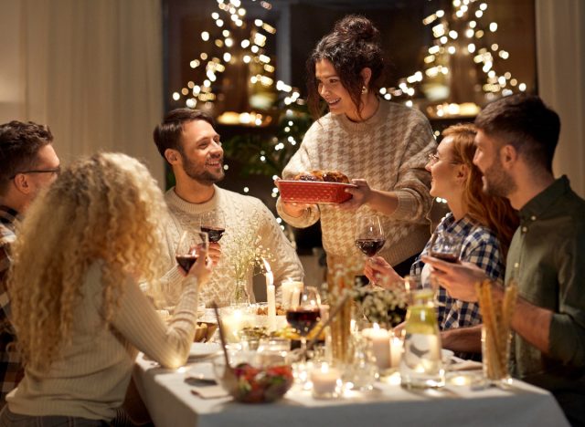 friends at holiday dinner table