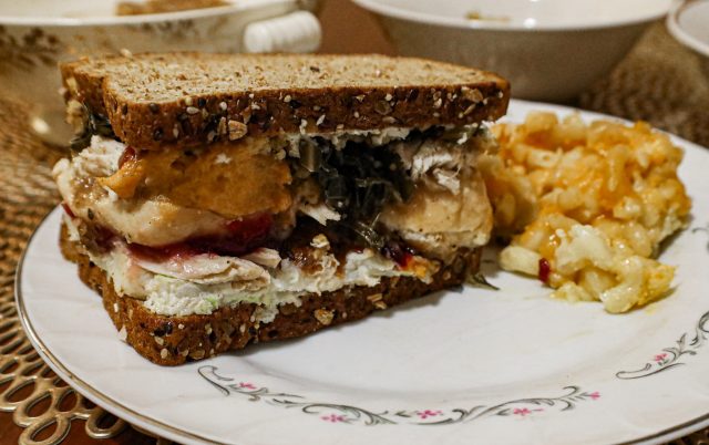Completed Thanksgiving leftover turkey sandwich with the moist-maker from 'Friends' with mac and cheese