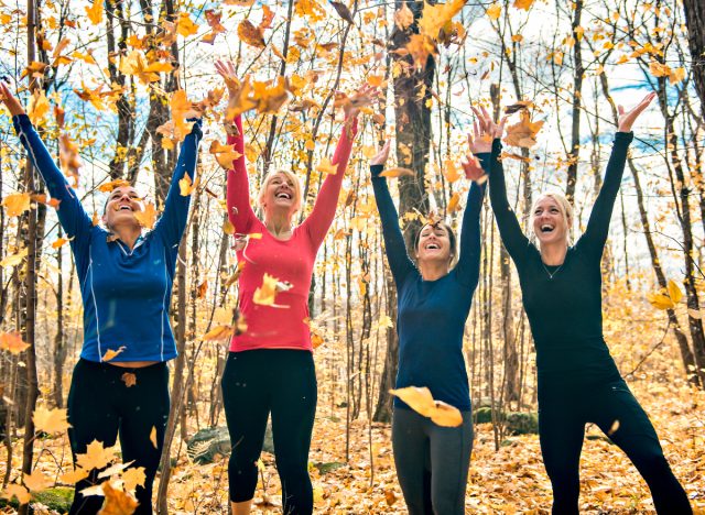 healthy fit friends autumn leaves, demonstrating ways to lose stubborn body fat