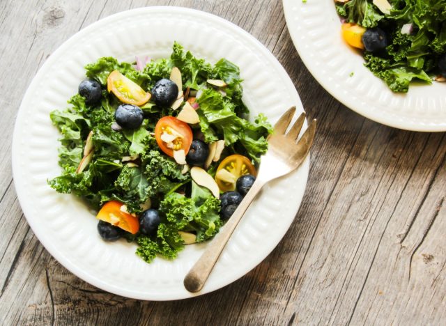 kale salad with blueberries and cherry tomatoes