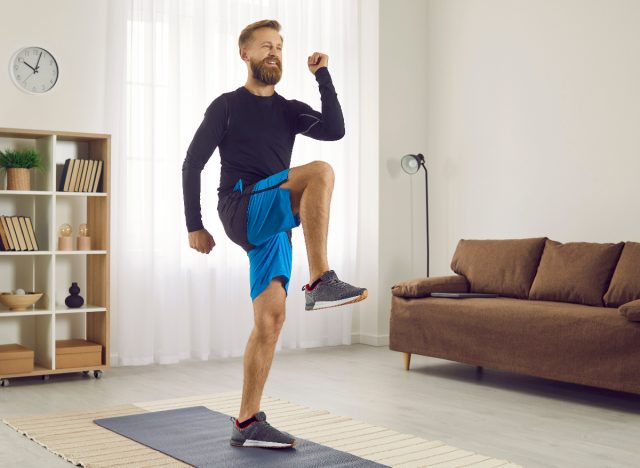 man performing high knees at home, workouts to maintain muscle tone in your 40s
