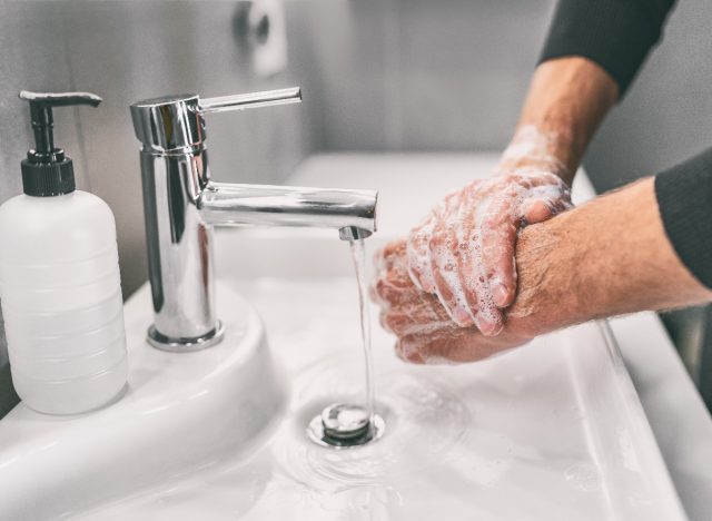 man washing his hands to keep his body healthy during flu season