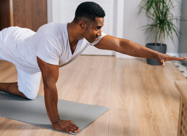 man performing yoga workout, weight loss for men tips