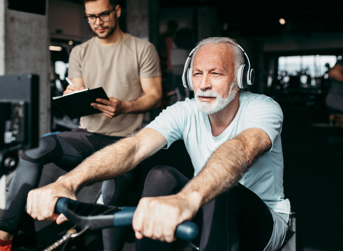 older man working out on rowing machine, demonstrating how to regain muscle mass after 60