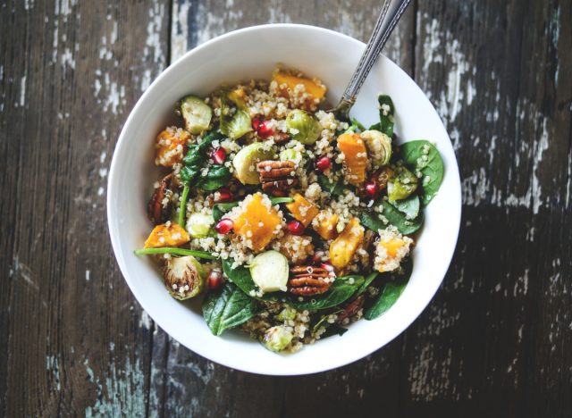 salad with quinoa, squash, brussels sprouts, pomegranate seeds, and nuts, concept of lazy ways to lose weight